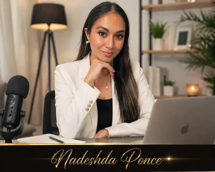 Professional workspace portrait of Nadeshda Ponce sitting at a desk with a laptop and microphone.
